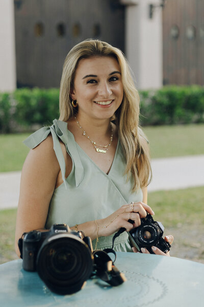 cristina pelino poses with cameras