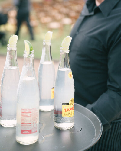 wedding cocktail hour topo chico bottles at central texas wedding