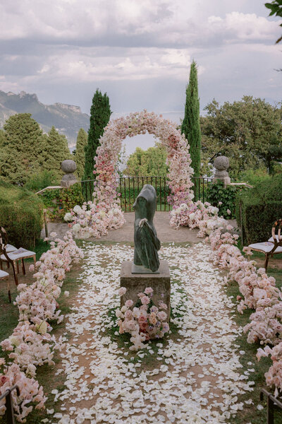 luxury wedding ceremony with pink florals in Italy