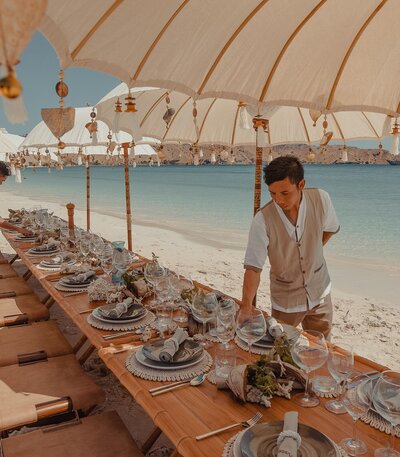 Aboard Prana phinisi yacht, immerse yourself in a private beach barbecue on secluded shores.