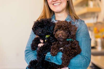 Virginia Beach photographers poses for a headshot with her dog for her outdoor session