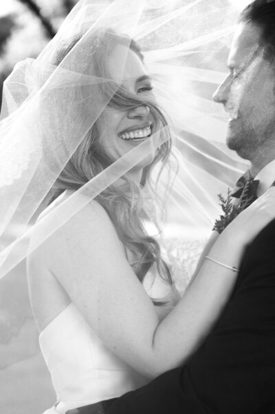 Bride and Groom Under Veil