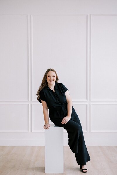Creative business owner smiling in natural light studio during personal brand session by Casie Marie Photography