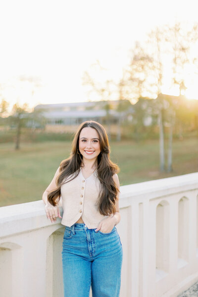 Girl smiling with a sunset background