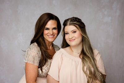 Mother and daughter pose for family portrait