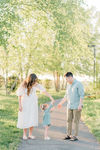 family-swinging-child