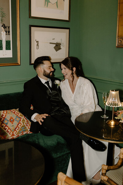 bride and groom laughing in bar newport ri