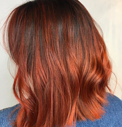 Image of client with copper red hair.