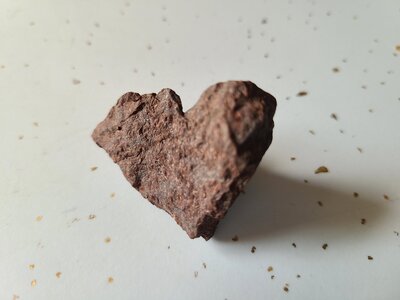 zoomed in picture of rock heart  with gold flecks radiating