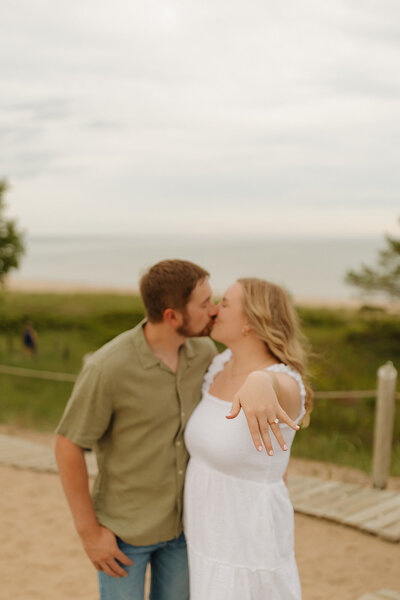 bride and groom share a sweet moment laughing and having fun on their wedding day at the vintage fields in madison wisconsin