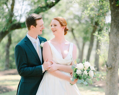 light and airy wedding photo of bride and groom at the ivory oak wimberley wedding venue
