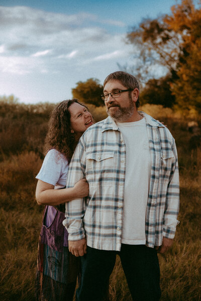 Couple standing looking over their garden