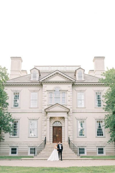 Couple stand in front of Great Marsh Estate 