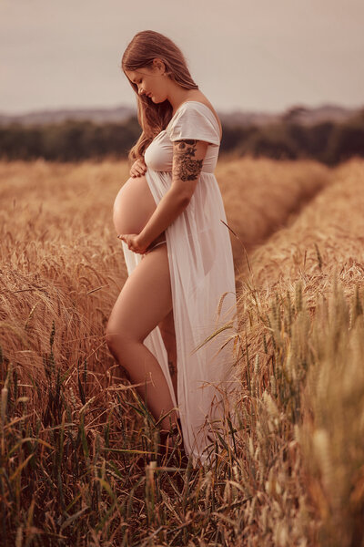 mother-posing-in-blue-dress-for-photoshoot-bath
