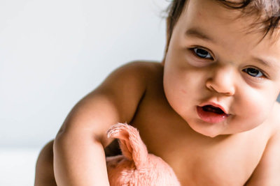 minimalist portrait of sitting baby