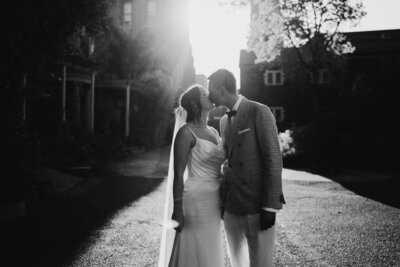 A love story in black and white: A Collingwood wedding photographer captures a couple's first kiss at the Collingwood Children's Farm.
