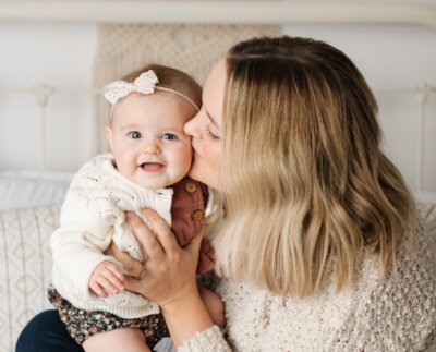 Maddie kissing her youngest daughter's cheek
