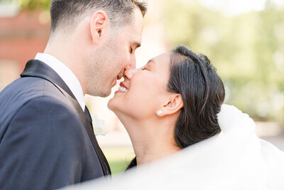 close up of bride and groom wedding first look kiss