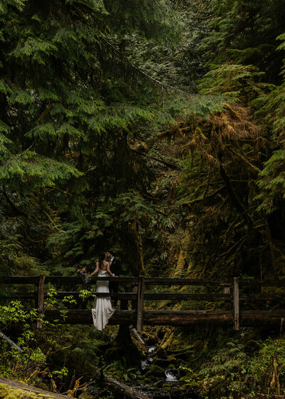 husband and wife kissing on banff elopement day