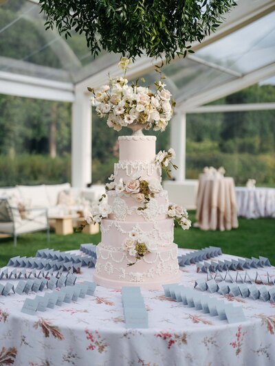 blush pink and red  floral destination wedding cake  Zambia