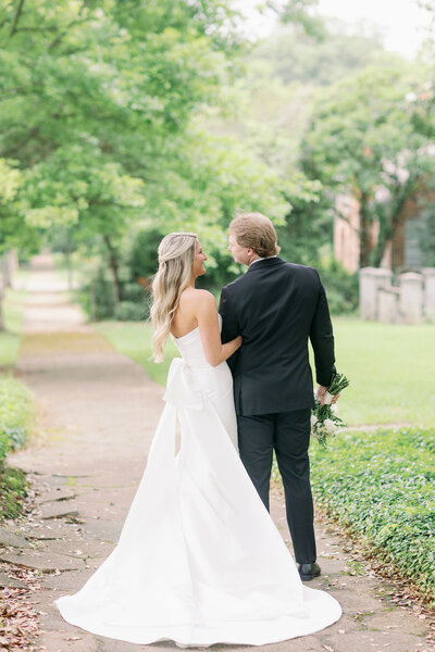 Bride and Groom smiling and turned around