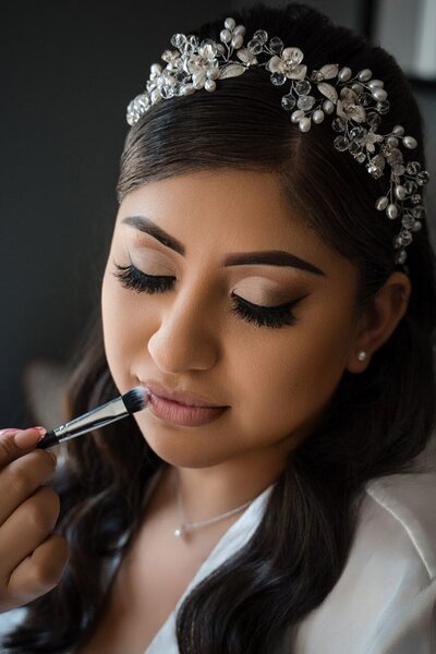 Bride getting her lip makeup done during wedding prep at The Union Club Hotel at Purdue University.