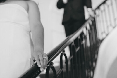 bride and groom walking down the stairs