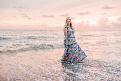 Headshot of a St. Pete photographer at sunset on the beach