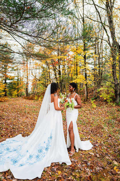 two brides at the alter with their bridesmaids