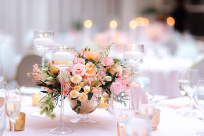 floral wedding centerpiece with pink and orange flowers