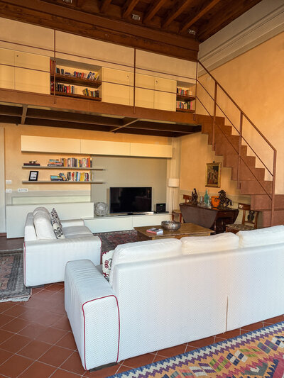 Large living area at the Guinigi Apartment in Lucca, Italy