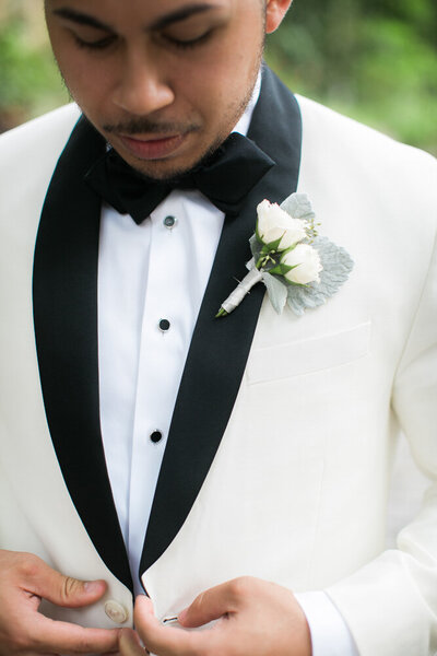 Wilmington NC groom in tux being photographed