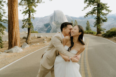 bride and groom kissing in Yosemite