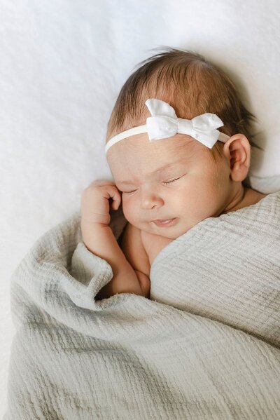 newborn portrait on white blanket