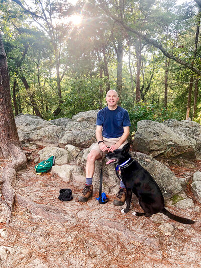 Kevin Roberts on a hike with his dog