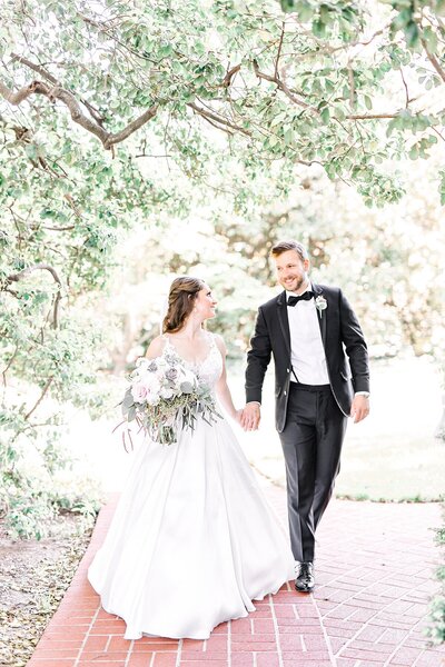 Bride and groom walk up memorial steps at their DC wedding