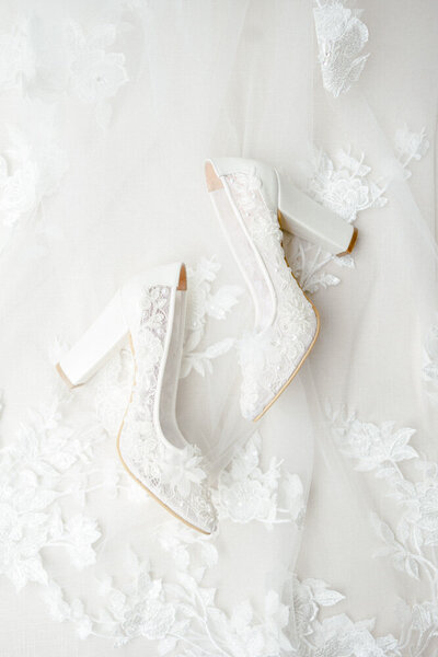 Photographer in Atlanta who takes bridal portraits | photo of lace shoes ontop of lace wedding dress train