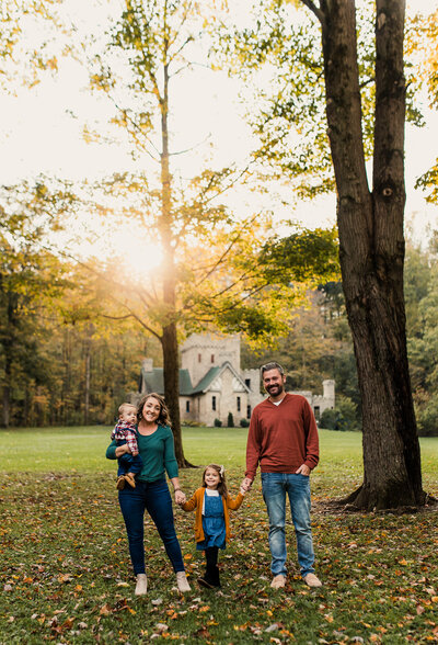 Family Photography Session With mom and dad holding two kids.