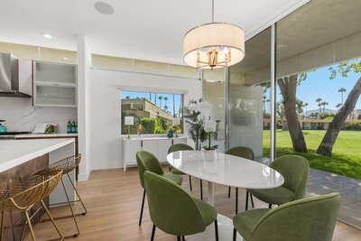 Photo of dining room with green accent chairs modern home staging