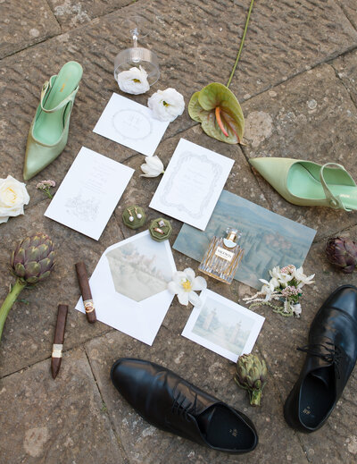 groom whispering in brides ear while she laughs