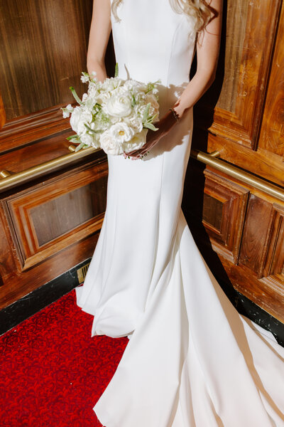 bride holding floral bouquet