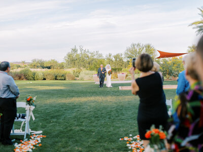 bride and groom walking down the aisle