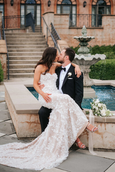 bride and groom kiss after their wedding ceremony in wilmington north carolina
