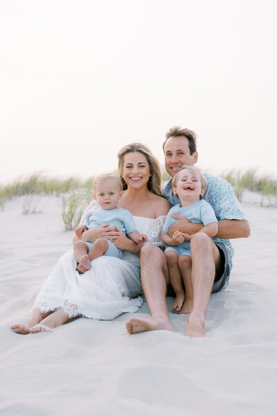 Family sitting on the beach in Cape May