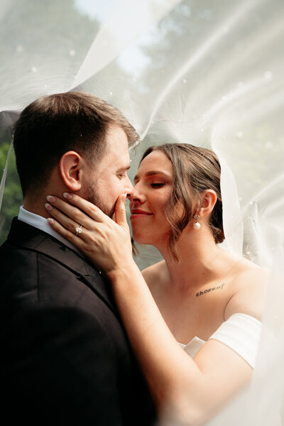 maryland couple laughing and kissing.