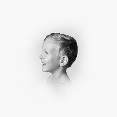 Black and white child portrait focused on emotional presence through children’s portrait photography in Michigan

