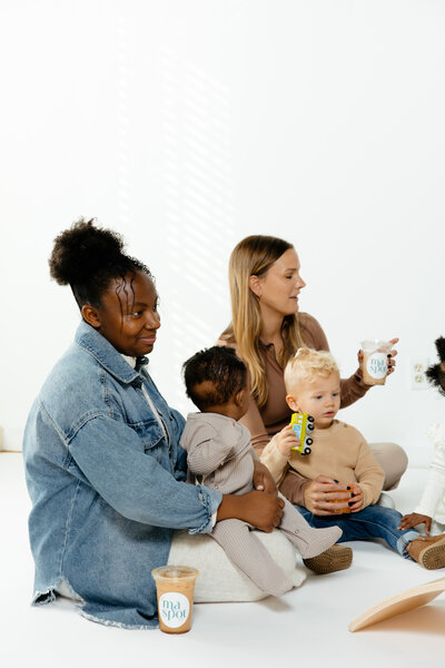 Women holding babies