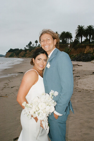 bride and groom in front of mountain