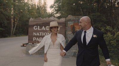 Couple looking at one another while eloping at Glacier National Park