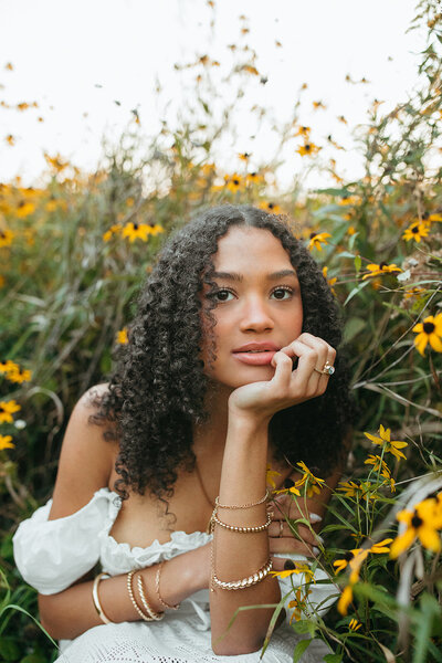 senior photos in minnesota with vintage chair and flowers